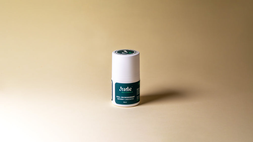 Jude Naturals 50ml Roll on unscented, on beige background. 