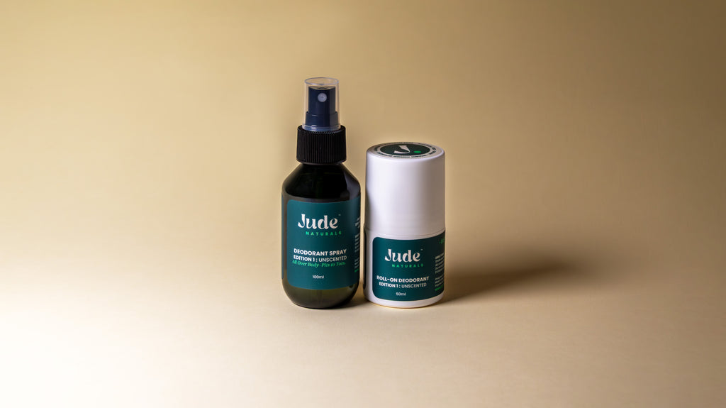 Jude Naturals deodorant bundle set with 100ml spray and 50ml roll-on, edition 1 unscented set on beige background. 